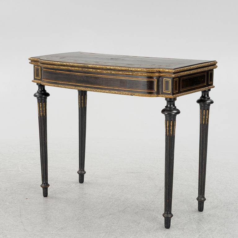 A Louis XVI style games table, circa 1900.