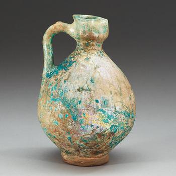 EWER, pottery. Turquoise glaze. Persia 13th century, probably Kashan.