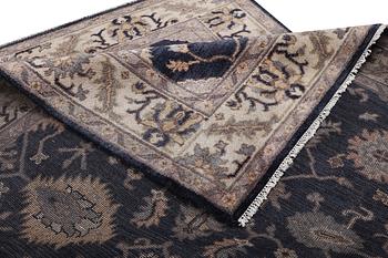 A Mamluk design carpet, c. 305 x 245 cm.