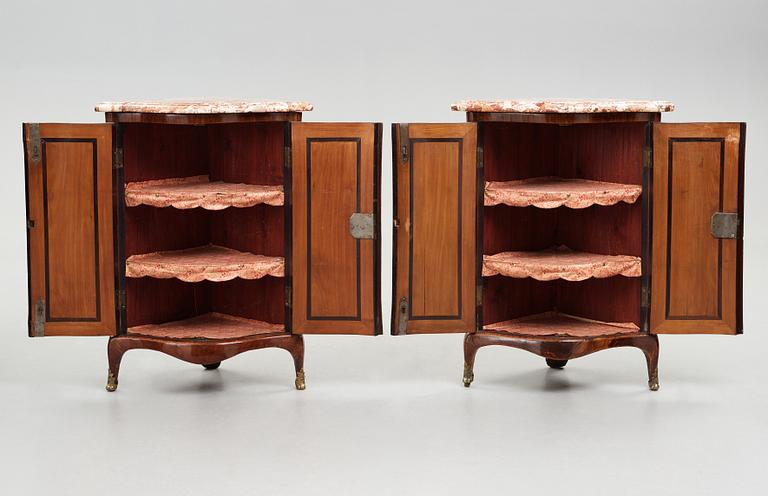 A pair of transiton 18th century corner cabinets by Pierre Migeon (probably Pierre III, master in Paris 1761-1775),