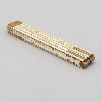 A 19th century bone folding ruler.