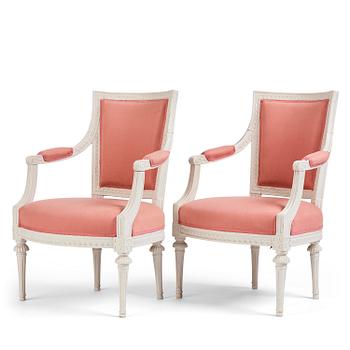 63. A pair of late Gustavian open armchairs by E. Ståhl (master in Stockholm 1794-1820).