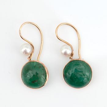A cabochon-cut emerald and cultured pearl parure with necklace, earrings and ring.