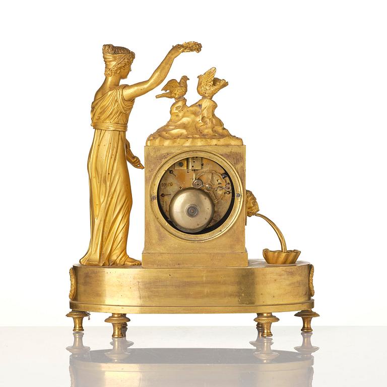 A French Empire figural mantel clock, early 19th century.