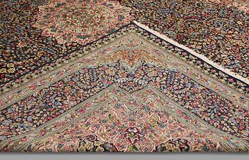 A Kirman Laver carpet, 'Millefleur', approx. 383 x 300 cm.