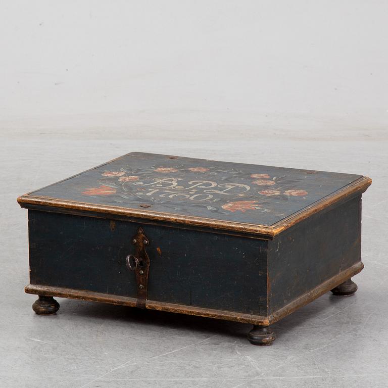 A painted wooden box, marked 1760.
