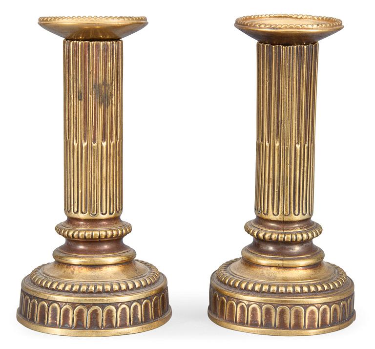 A PAIR OF GUSTAVIAN CANDLESTICKS.