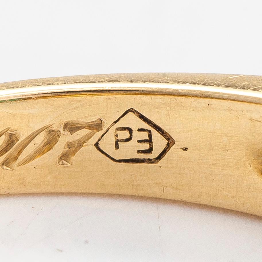 An 18K gold ring, set with emeralds and princess-cut diamonds totalling approx. 0.34 ct. Finnish import hallmarks.