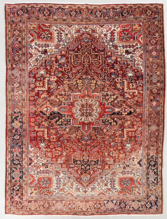 A semi-antique Heriz carpet, North west Persia, c. 366 x 282 cm.