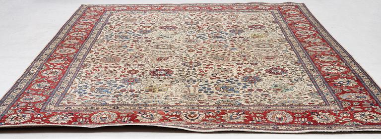 A Tabriz carpet, c. 385 x 287 cm.