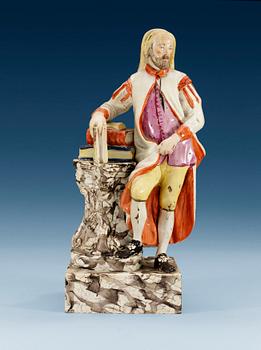 1217. A creamware figure, presumably England, 18th Century.