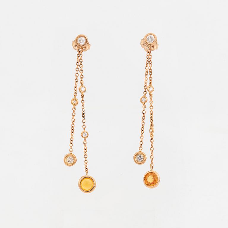 Yellow sapphire and brilliant-cut diamond earrings.