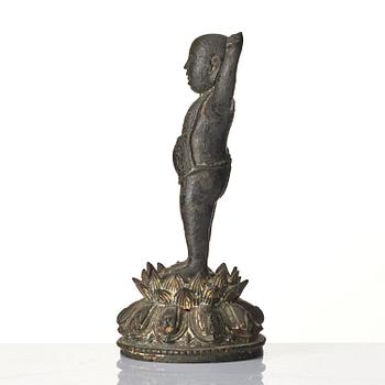 A bronze sculpture of buddha as a child, Ming dynasty (1368-1644).