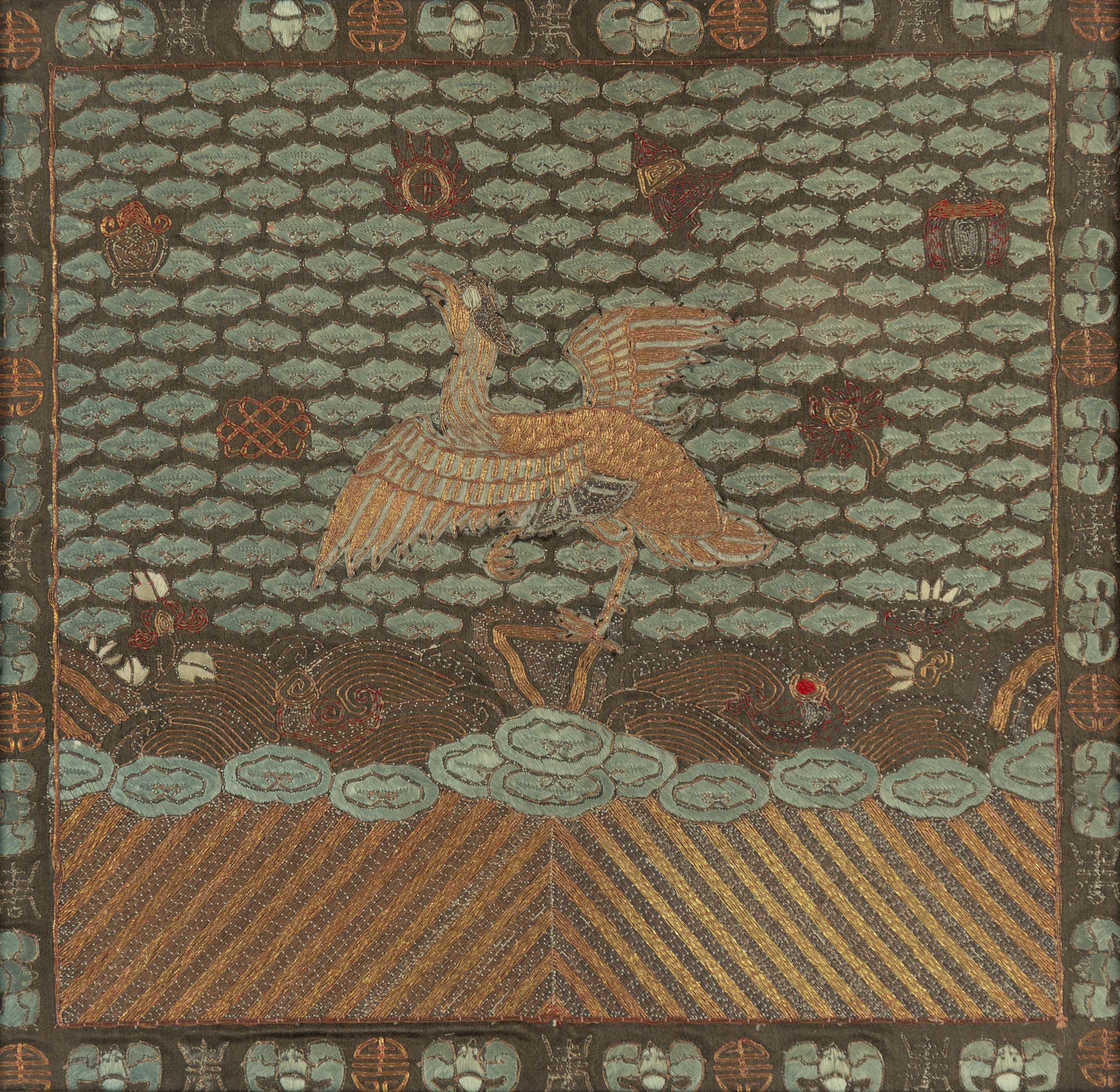 An embroidered civil official's rank badge with a bird, 'buzi', Qing dynasty.