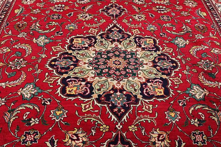 An oriental carpet, c. 385 x 300 cm.