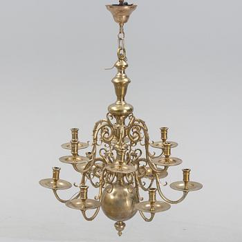 A brass Baroque style chandelier, 20th Century.