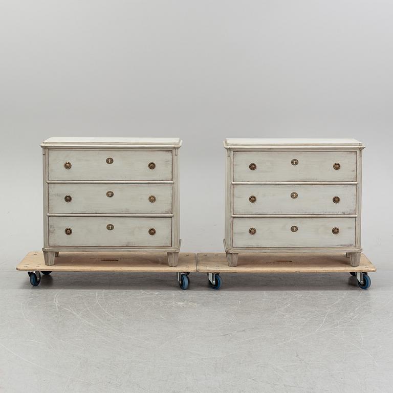 A pair of painted late gustavian-style chest of drawers.