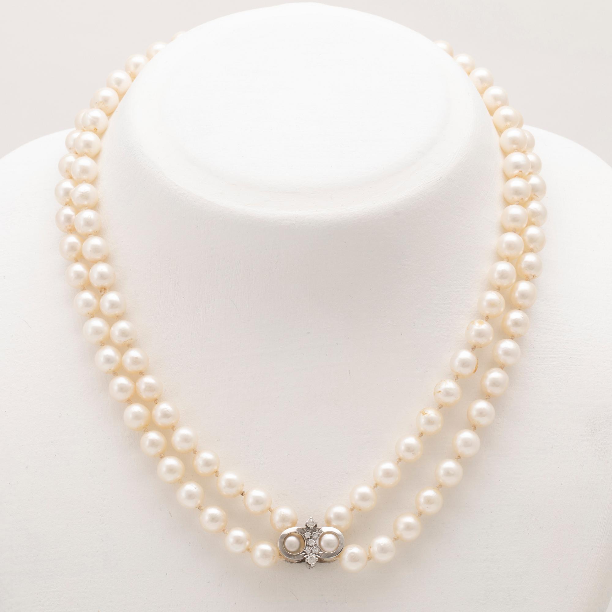 A necklace with cultured pearls and clasp in 18K white gold with round brilliant-cut diamonds, Hellström & Åhrling 1981.