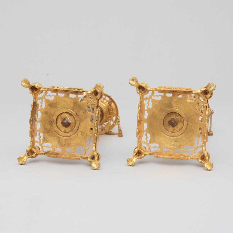 A pair of Swedish late 19th century brass and porphyry-imitation glass candlesticks.