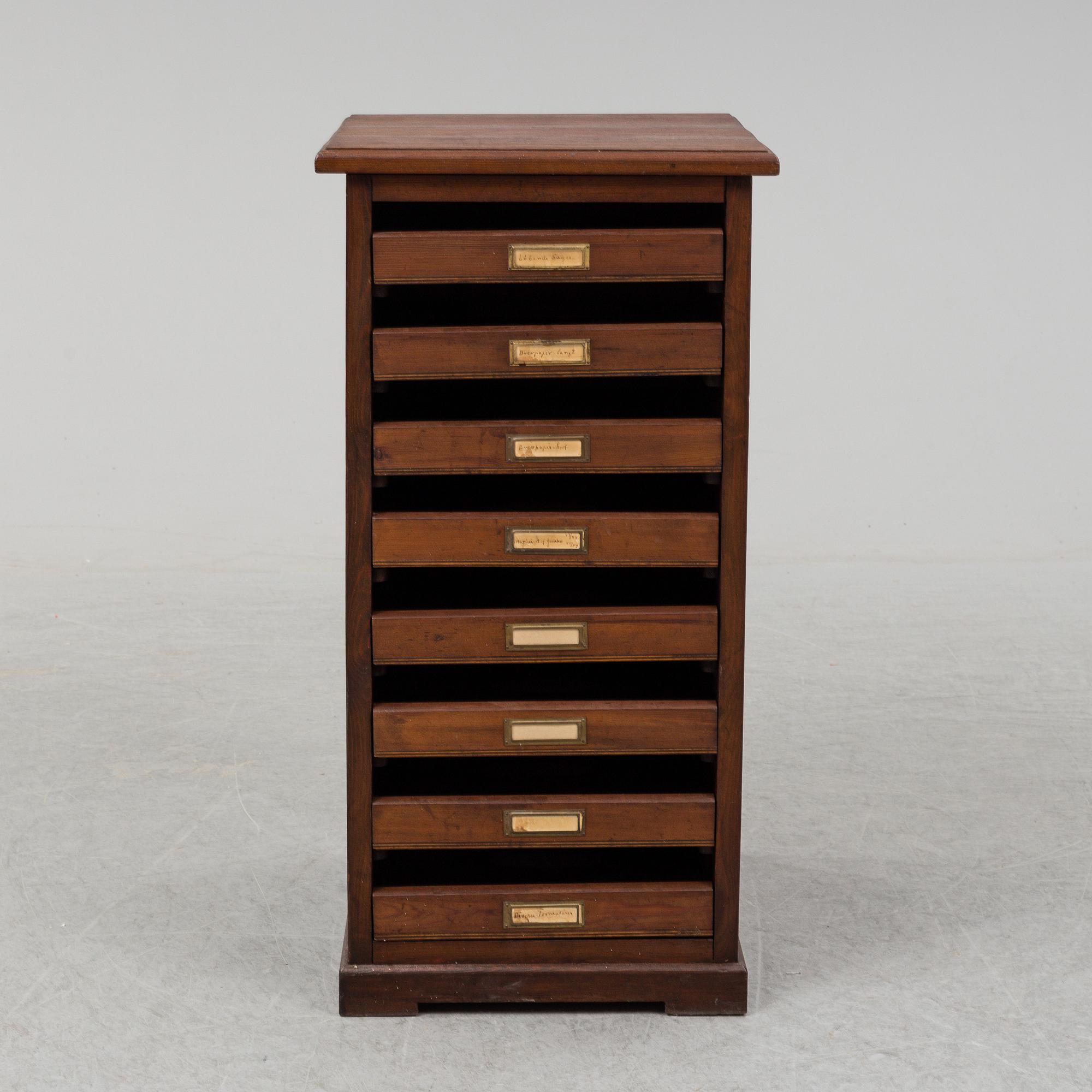 An early 20th Century stained pine office furniture.
