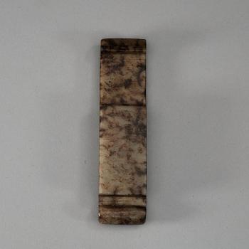 A carved white and brown mottled nephrite scabbard clasp (zhi), Qing dynasty (1644-1912).