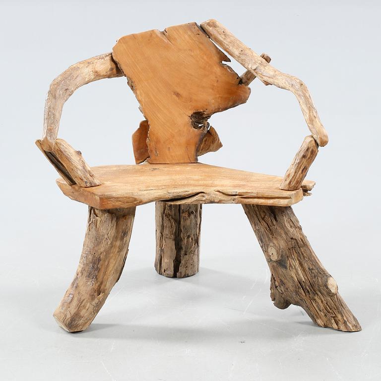 A wooden armchair, modern made.