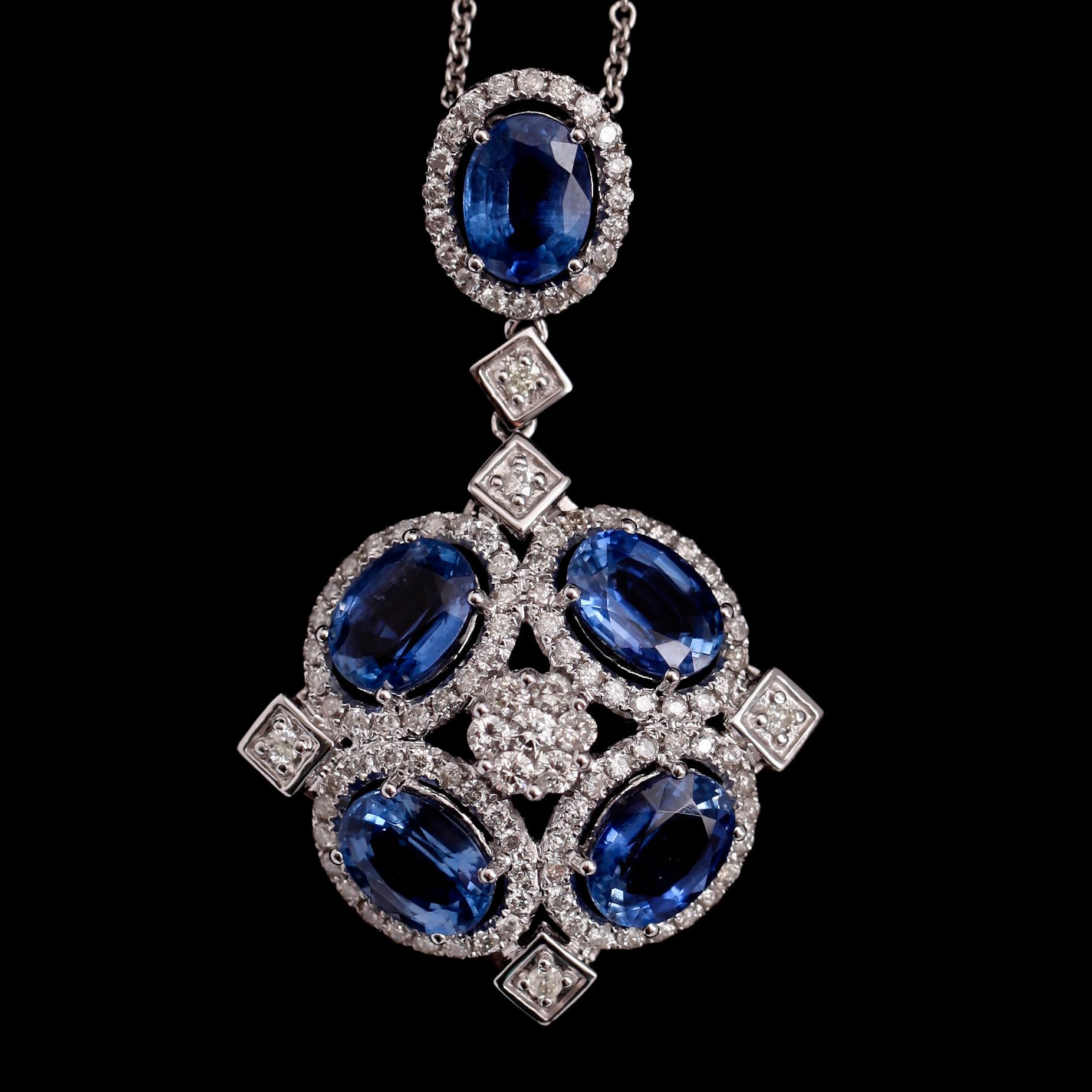 COLLIER, 18 k vitguld, hänge med briljantslipade diamanter totalt 1.14 ct samt blå kyaniter.