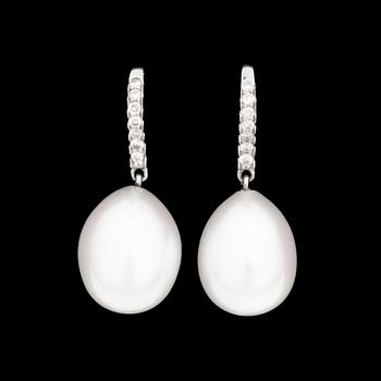 1036. A pair of cultured pearl earrings set with brilliant-cut diamonds.