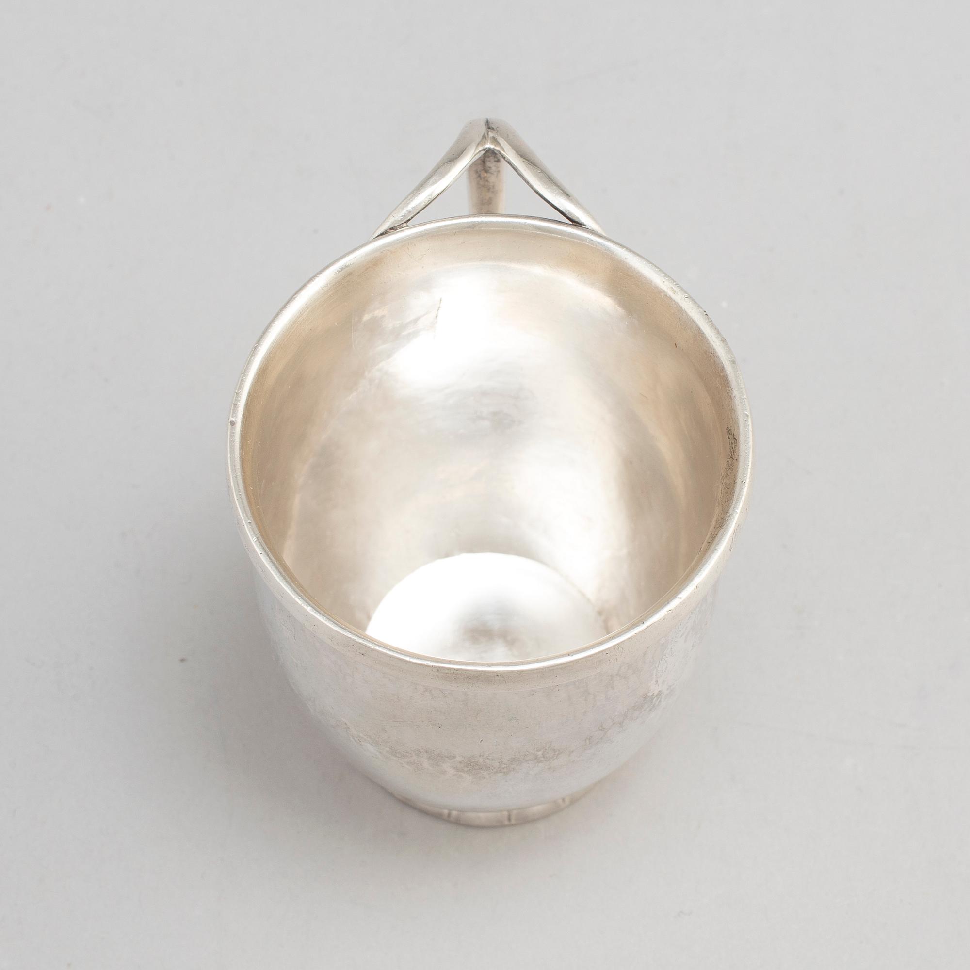 GEORG JENSEN,  a 830/1000 silver mug and  a bowl (a christening set), Copenhagen ca 1918-1927, design nr 127, 158.