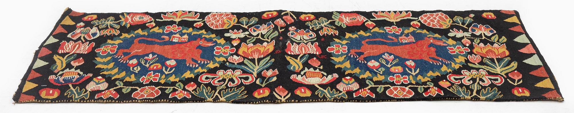 A cushion, 'Red Lion' (Rött Lejon), tapestry weave, c. 102 x 46cm, southwestern Scania, first part of the 19th century.