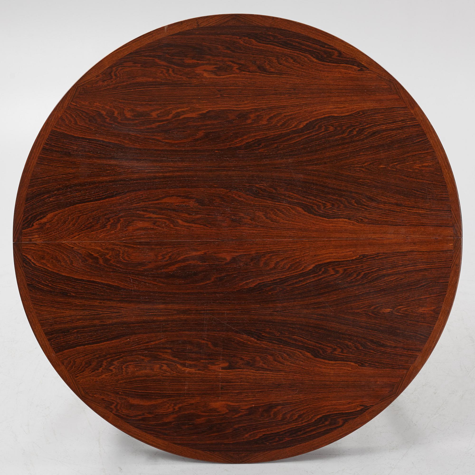 Niles Otto Møller, a rosewood veneered table with four chairs, JL Møller, Denmark, 1950's/60's.