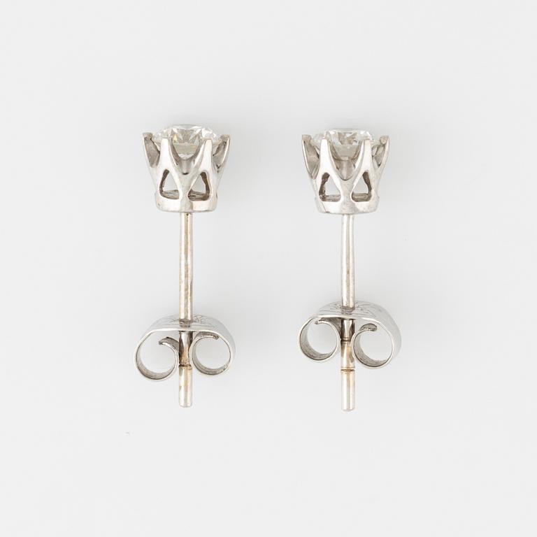 Brilliant cut diamond stud earrings.