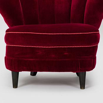 A pair of mid-20th century armchairs.