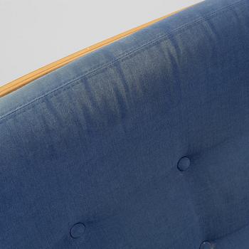 Bruno Mathsson, a pair of armchairs with ottomans, 'Ingrid', Dux, second half of the 20th century.