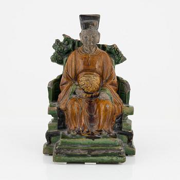 A ceramic sculpture of a seated daoist dignitary, Ming dynasty, (1368-1644).