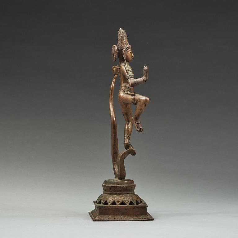 A bronze scupture of Krishna who has konkured the five headed serpant, India, early 20th Century.