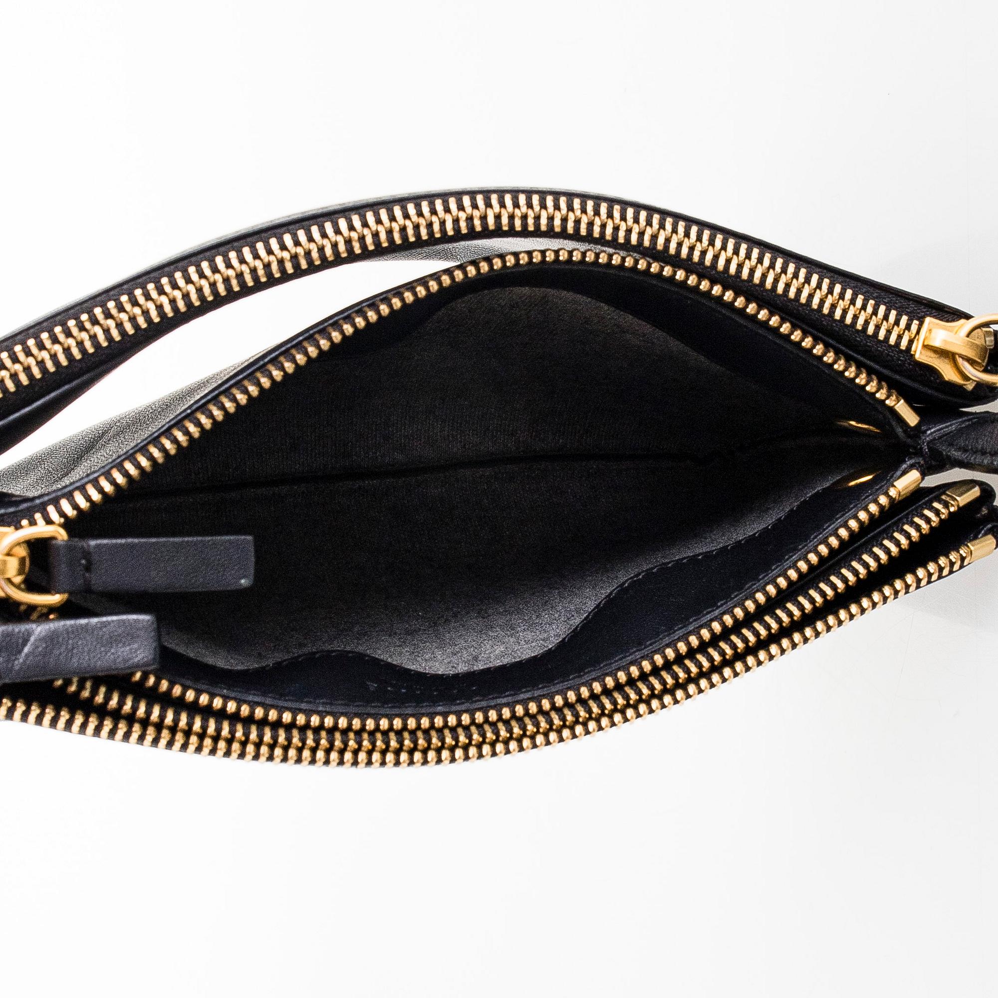 Céline, a black leather 'Trio Small' bag.
