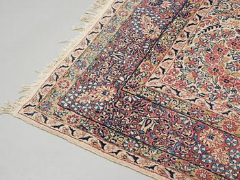 A semi-antique/old Kerman carpet, around 361 x 264 cm.
