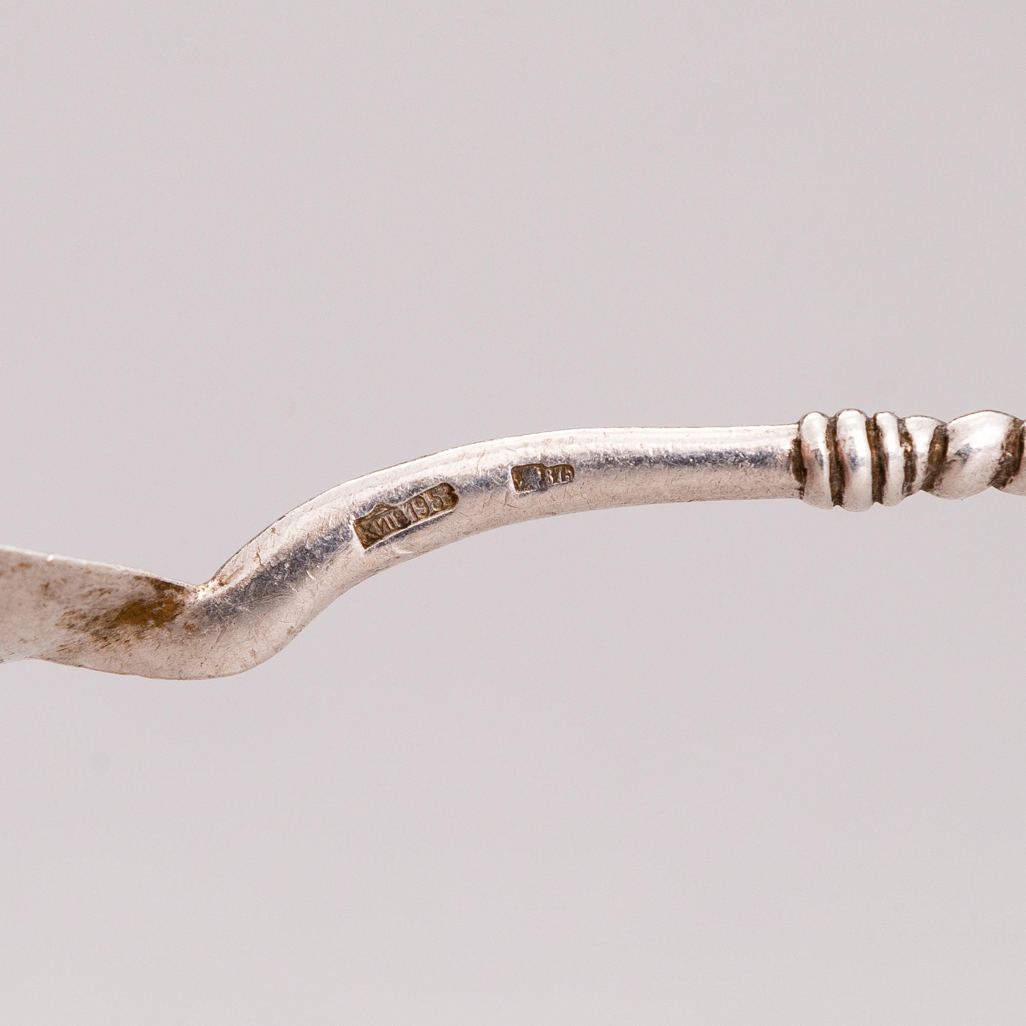 A Russian silver teaglass holder and seven teaspoons, Moscow and Kiev, first half and mid-20th Century.