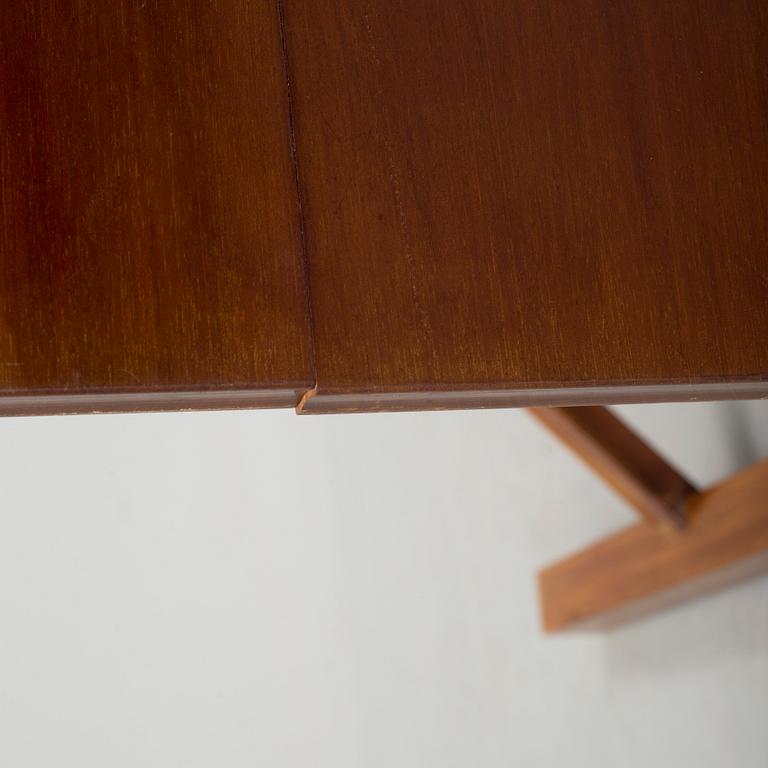 A mid 20th century mahogany veneered table from Nordiska Kompaniet (NK).