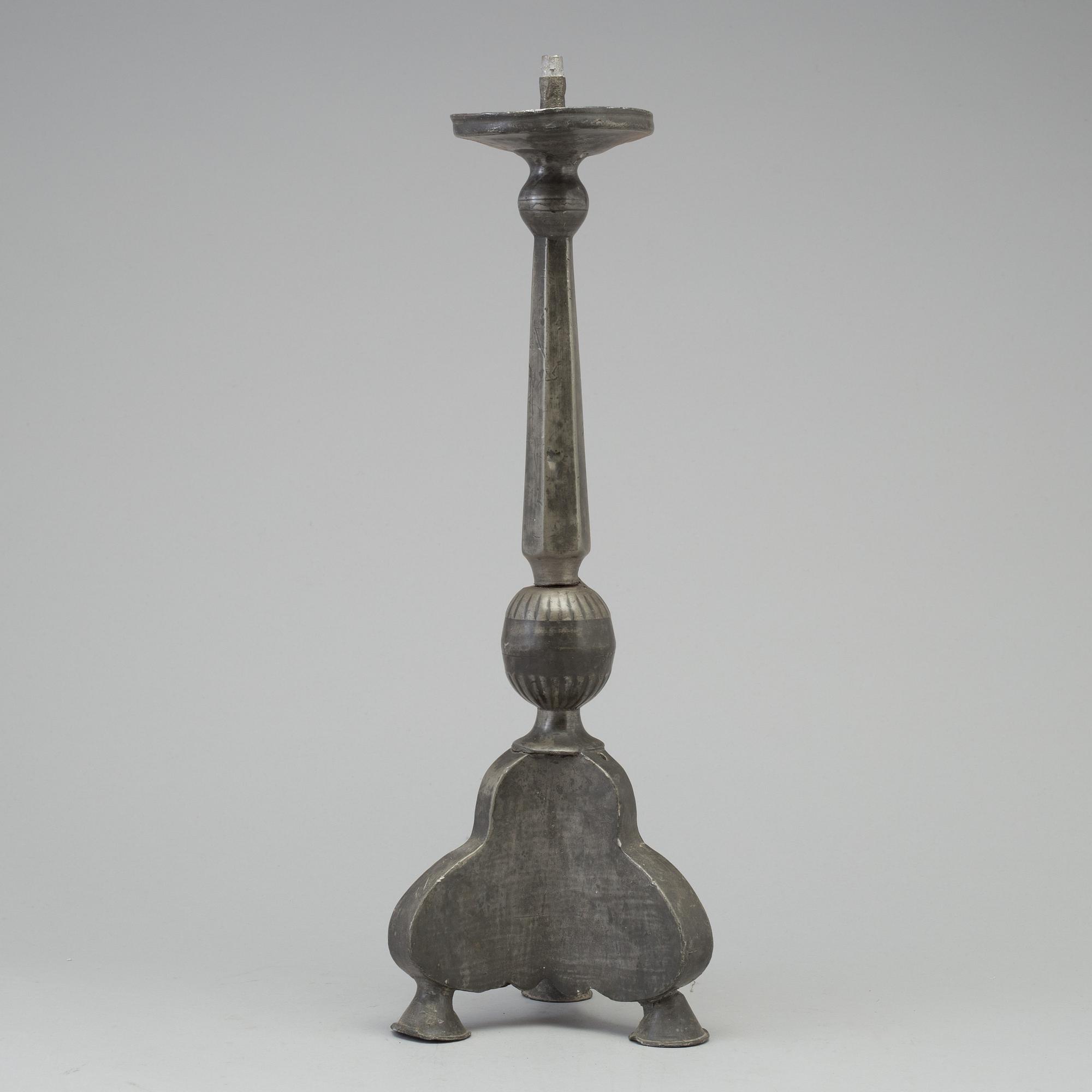 A 17th century pewter candlestick.