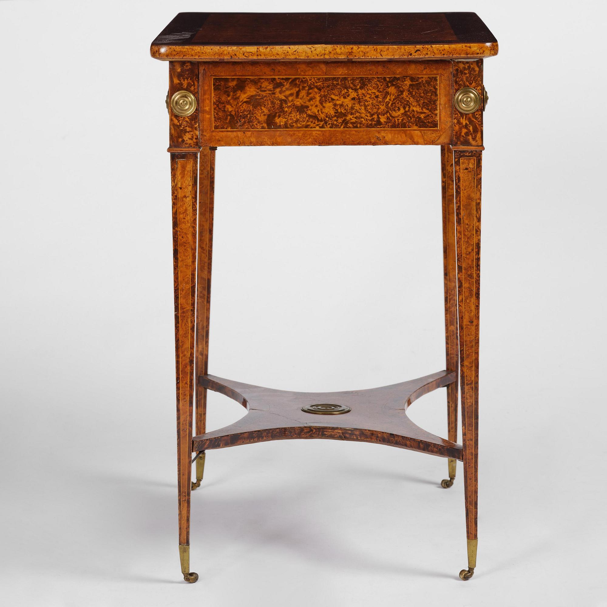 A Gustavian burr-parquetry and bilt brass-mounted table by A. Lundelius (master in Stockholm 1778-1823).