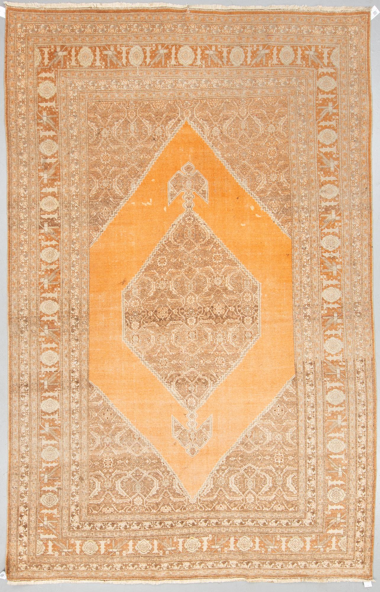 MATTO, an antique Tabriz, ca 338,5 x 210,5-222,5 cm.