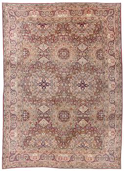399. An antique Kerman Laver carpet, south east persia, ca 501 x 359 cm.