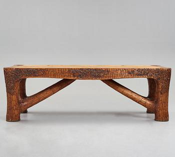Gustaf Fjaestad, an Art Nouveau carved pine table, Arvika Sweden 1914, a double to the table in the Thiel Collection,