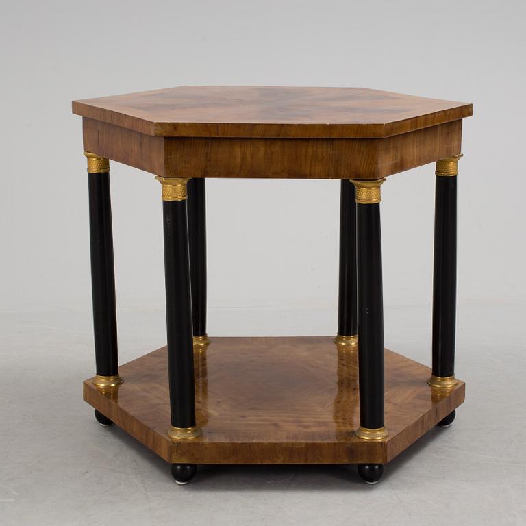 An empire style table, early 20th century.