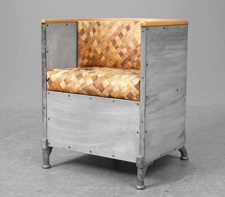 A Mats Theselius "Aluminiumfåtölj" easy chair, upholstered with fretted birch bark, Källemo, Sweden ca 1990.