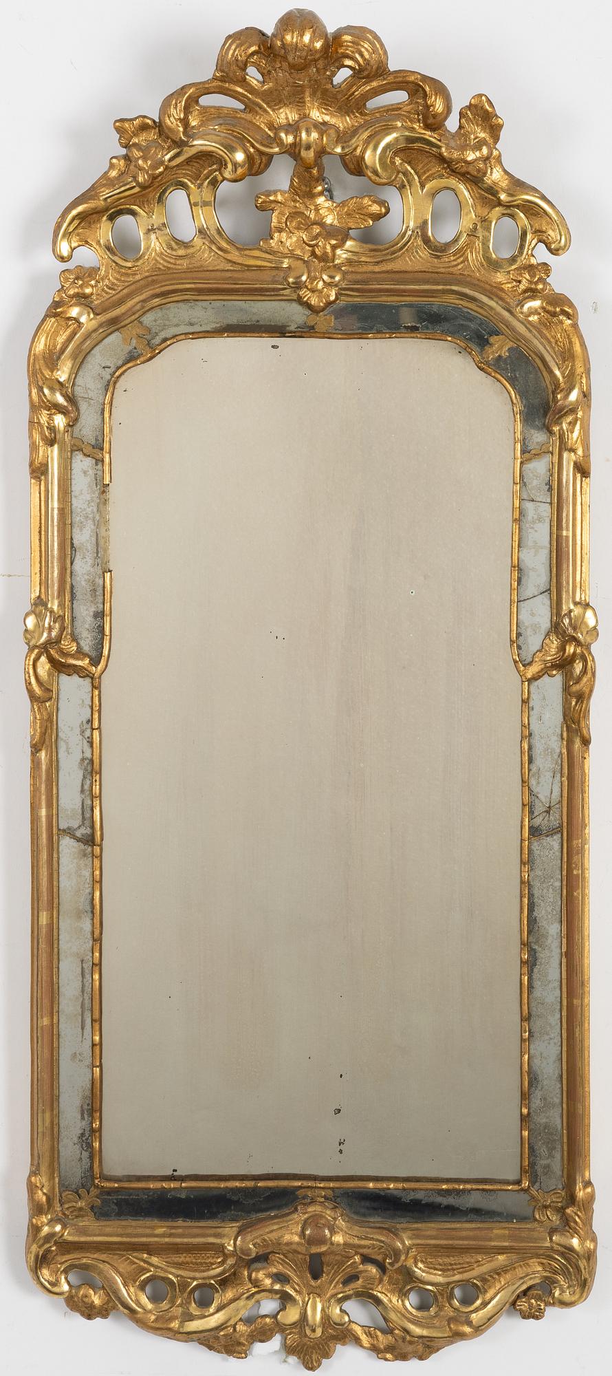 A Swedish giltwood rococo mirror, Stockholm, ltaer part 18th century.