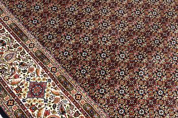 A Moud part silk carpet, signed, 335 x 250 cm.