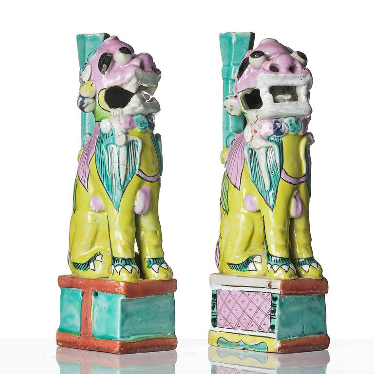 A pair of famille rose 'buddhist lion' joss stick holders, Qing dynasty, circa 1800.